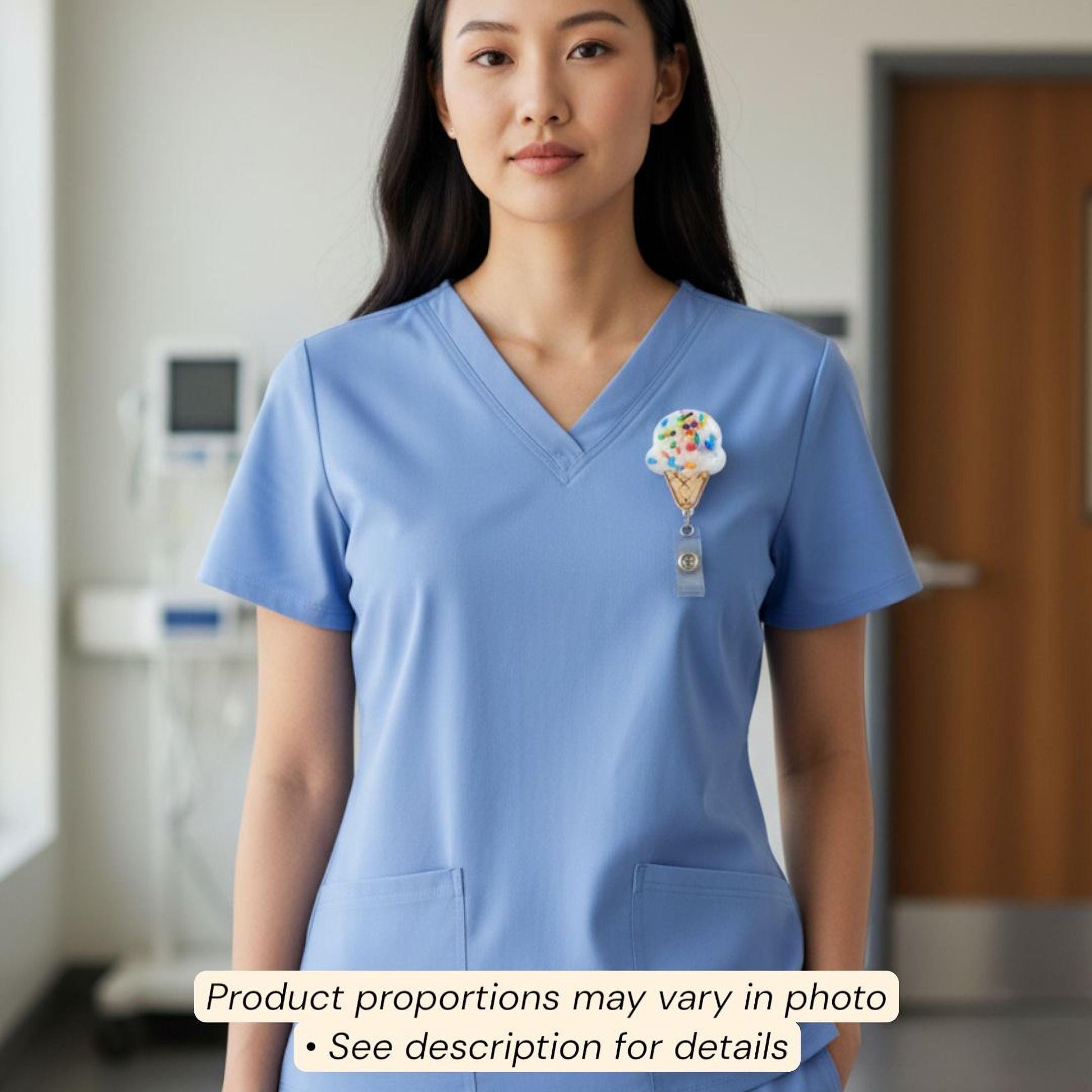 A woman wearing a blue medical uniform with a badge on the left side of her chest.