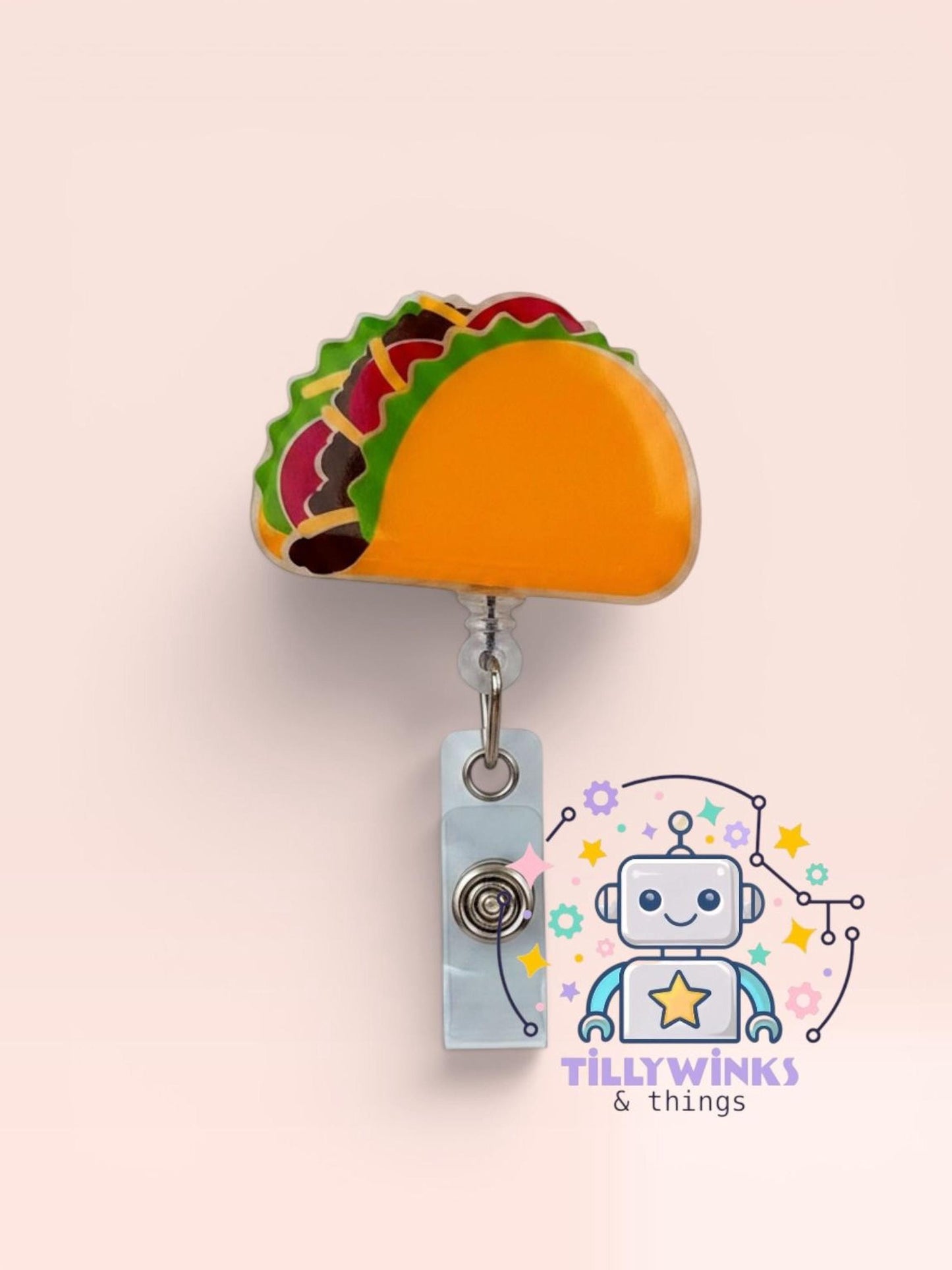 a colorful taco-shaped badge with a robot-like character on it, set against a light pink background.
