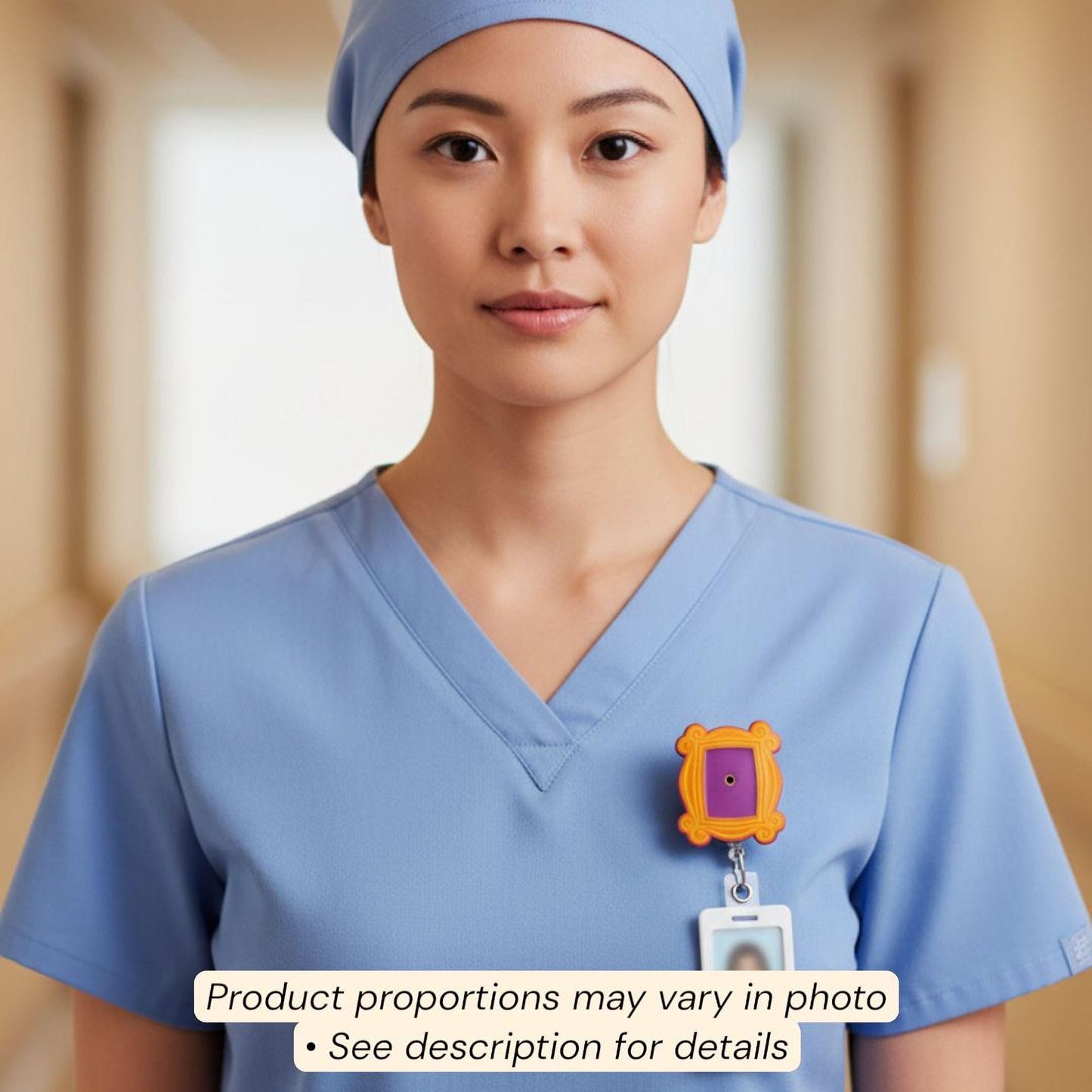 A woman wearing blue scrubs and a blue cap is standing in a hallway.
