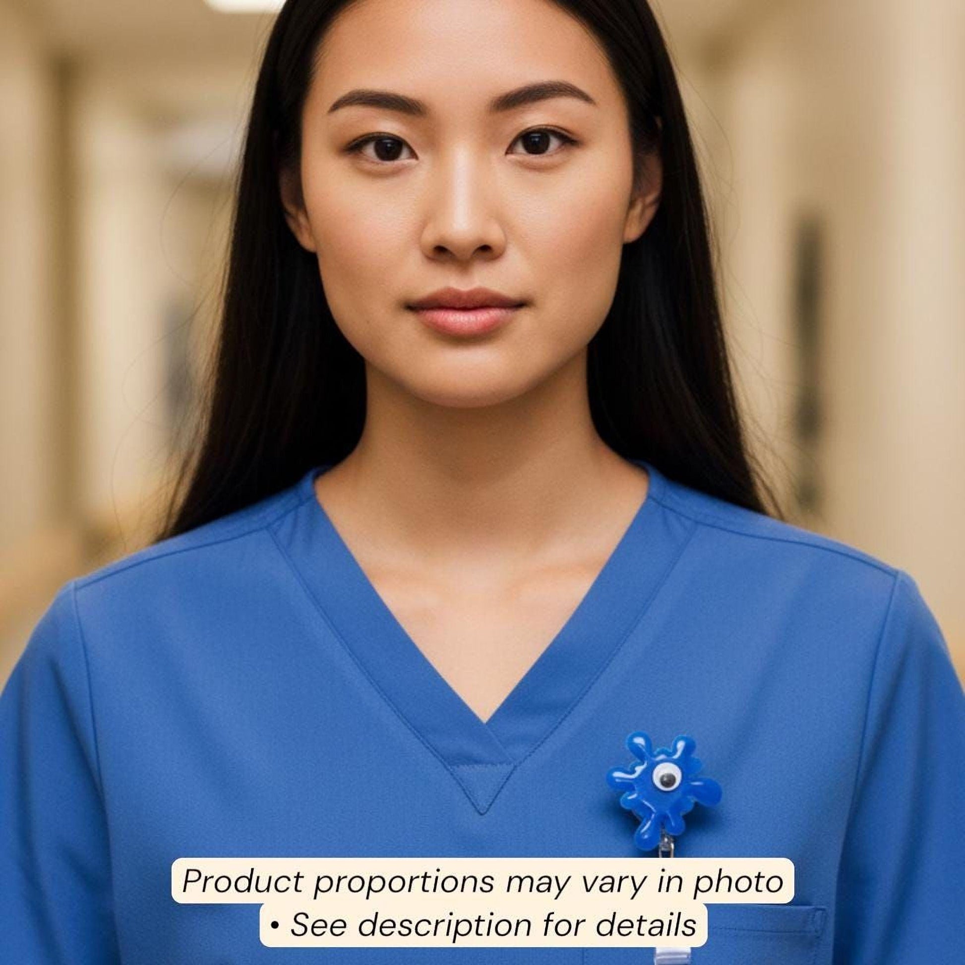 A woman wearing a blue medical uniform with a blue flower badge on the left side of her chest.