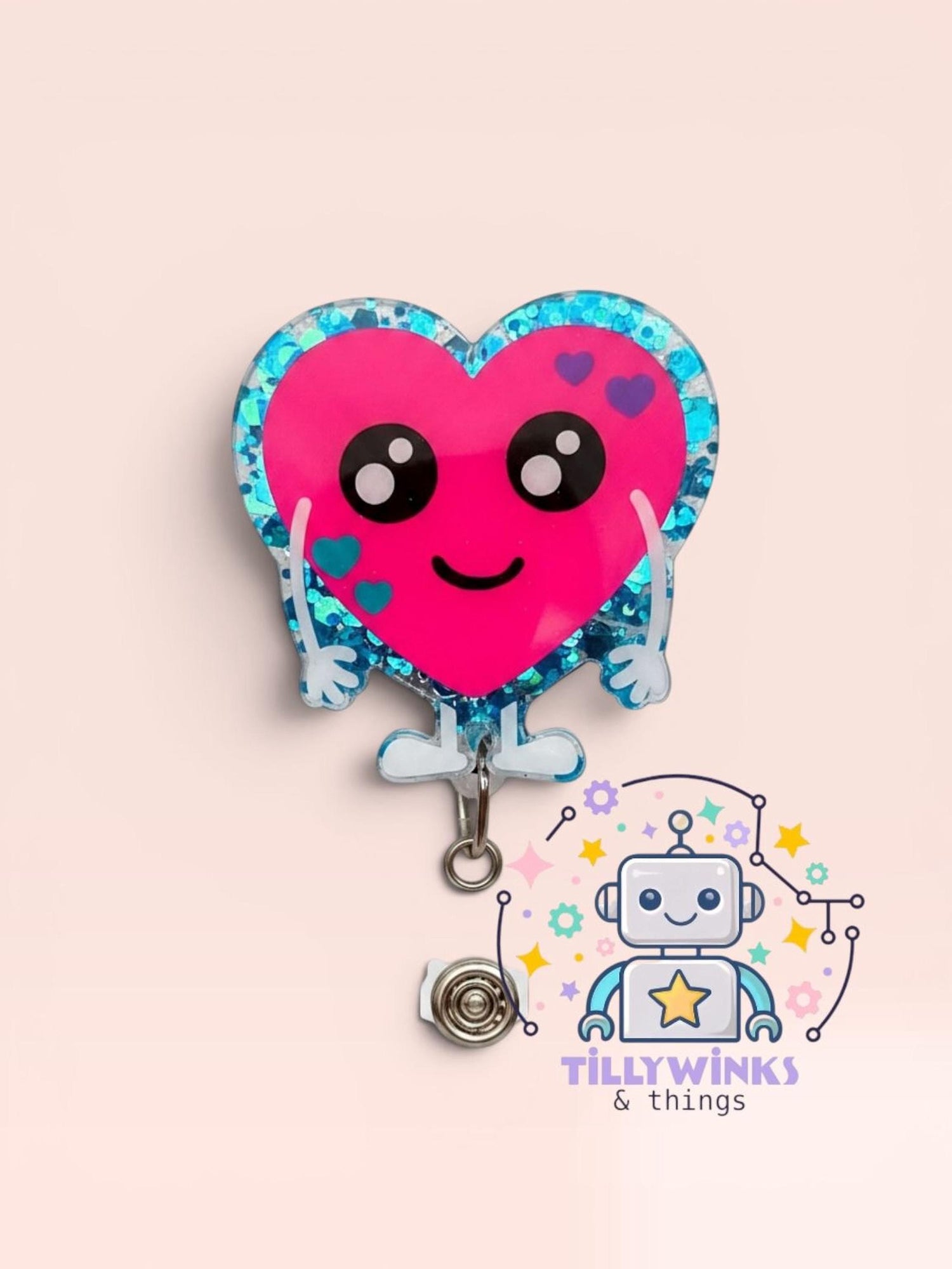 A pink glitter heart-shaped badge with a smiling face and eyes, attached to a chain.