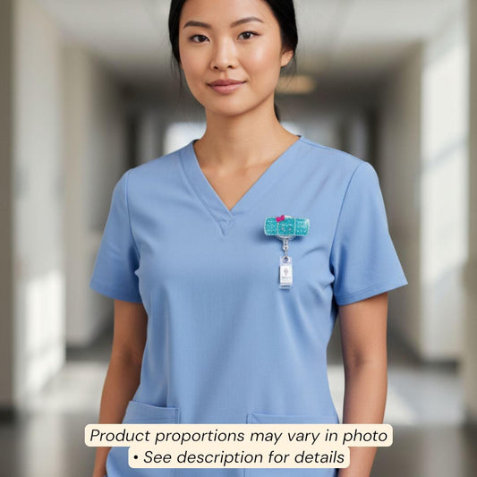 A woman wearing a blue medical uniform with a badge on her left side.