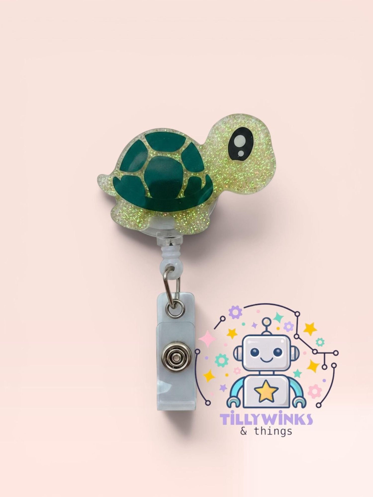 A neon green turtle-shaped badge holder with a white clip attached to it, along with a robot-like character design and text.