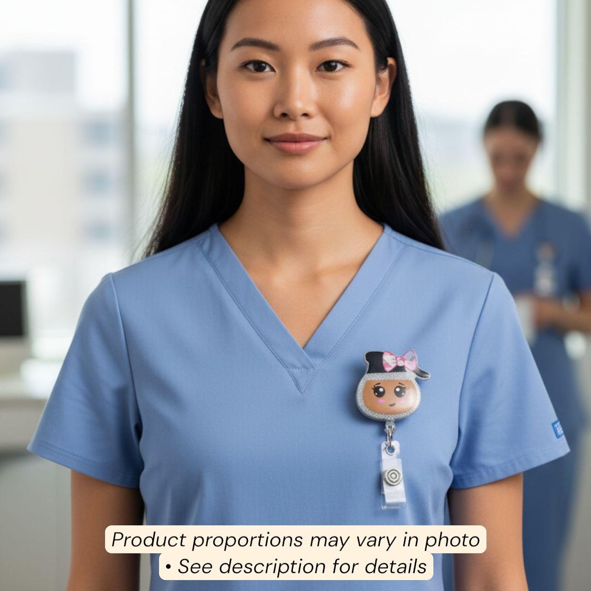 A woman wearing a blue medical uniform with a badge featuring a cartoon character on it.