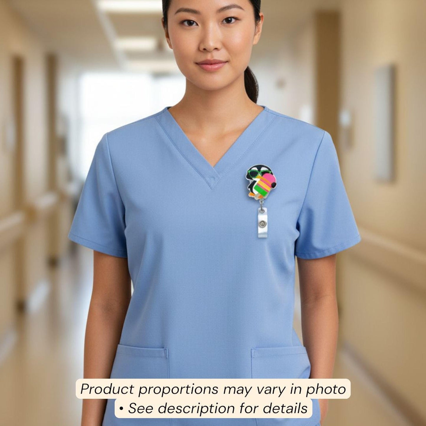 A woman wearing a blue medical uniform with a colorful badge on the left side of her chest.