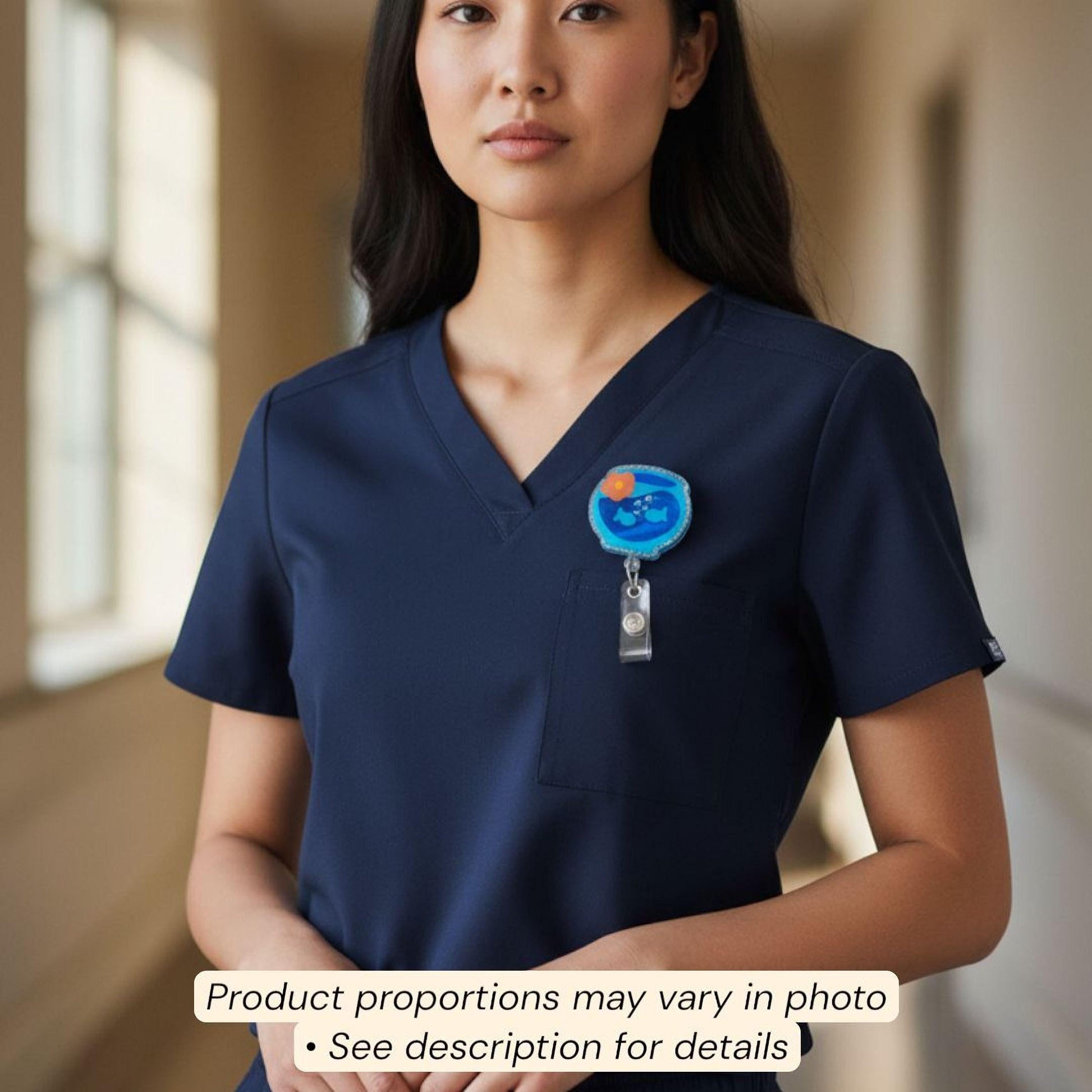 A woman wearing a blue medical uniform with a badge on her left side.