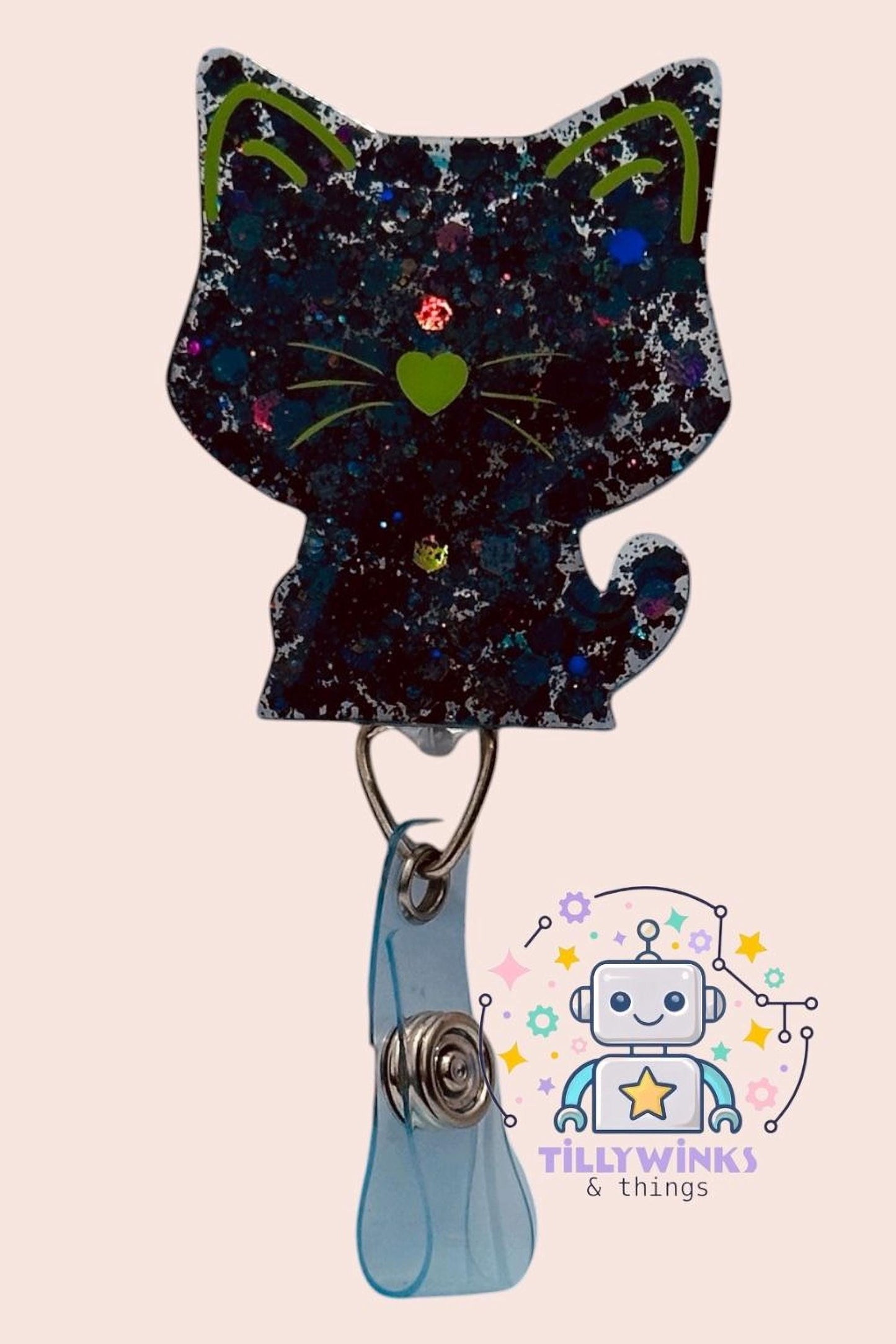 A black cat-shaped badge with a heart-shaped eye and a robot-like character in the background.