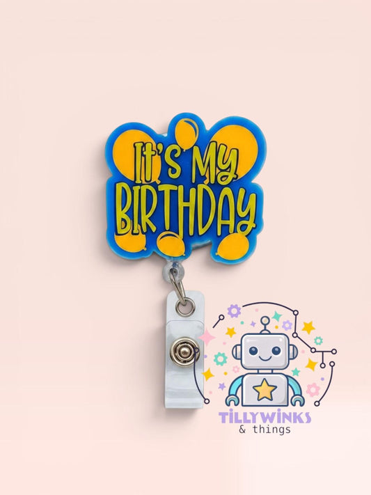 a blue and yellow badge with the text "It's My Birthday" and a robot graphic, as well as a logo for "Tillywinks & things".