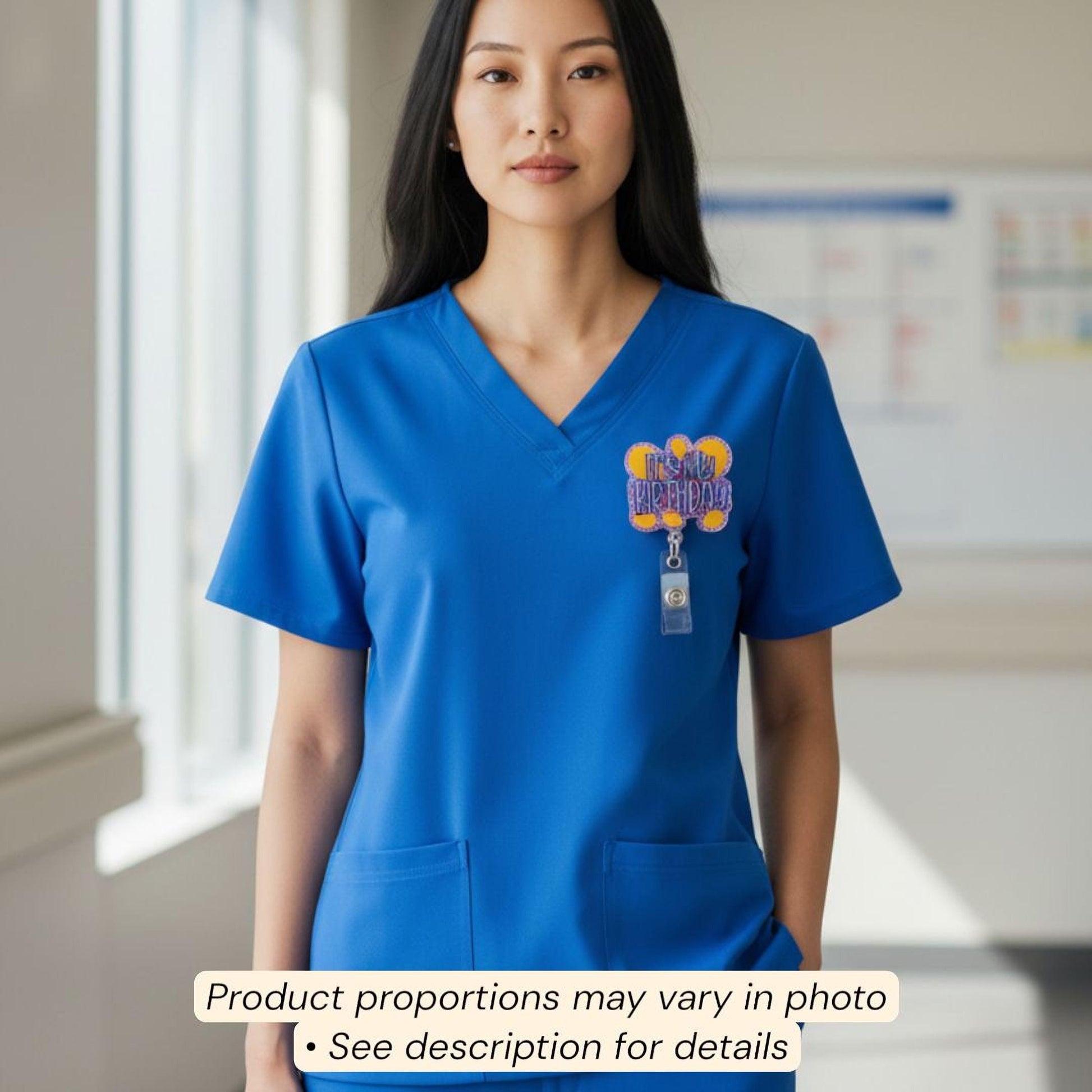 A woman wearing a blue medical uniform with a badge on the left side of her chest.
